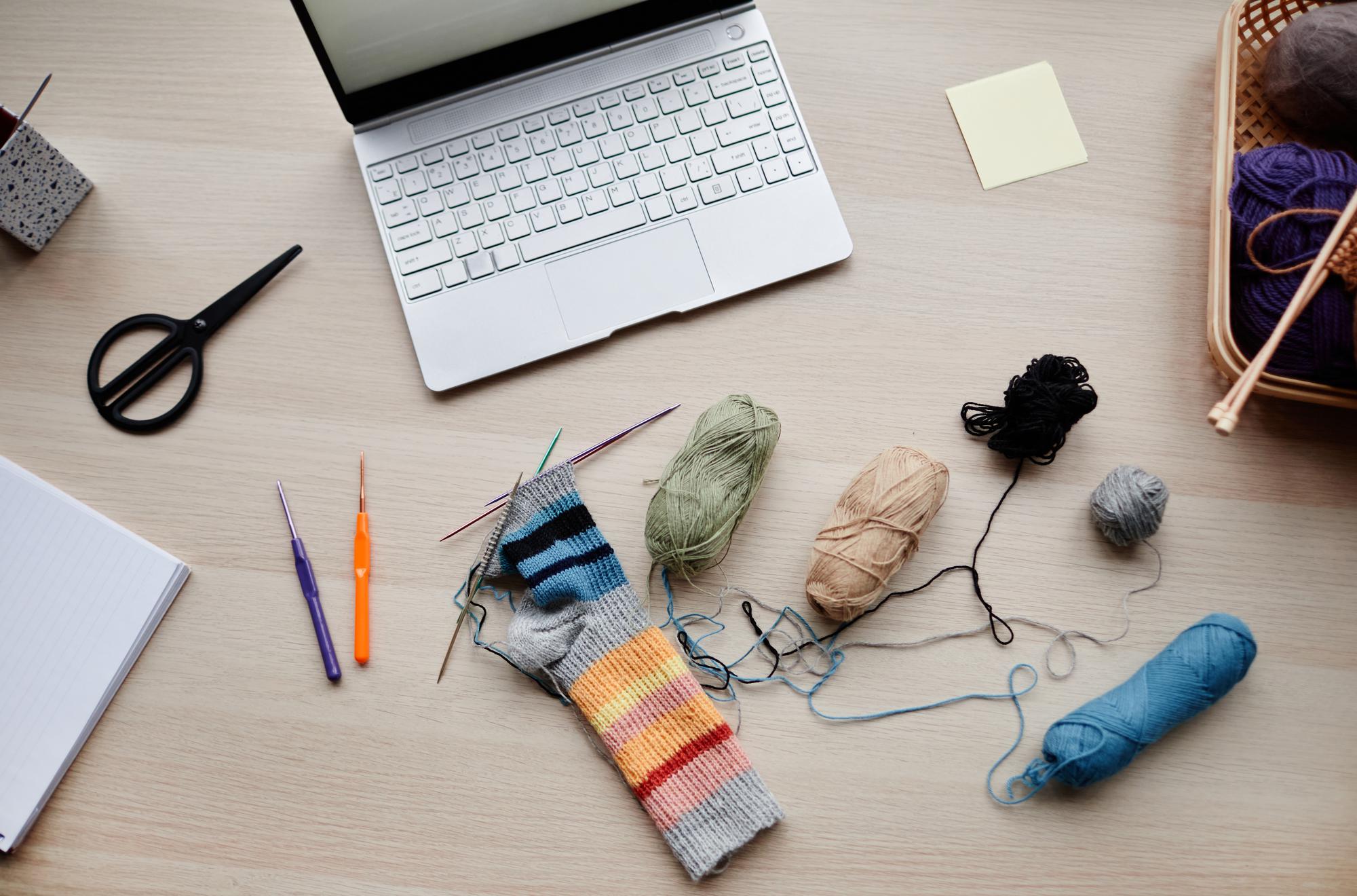 Studio workspace with embroidery tools and threads