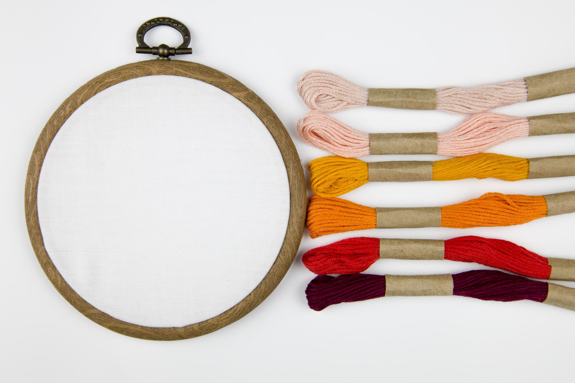Assortment of embroidery samples framed